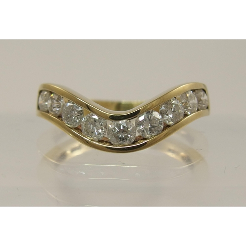 797C - A 9ct gold diamond wave ring