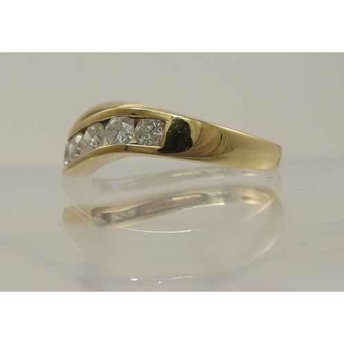 797C - A 9ct gold diamond wave ring