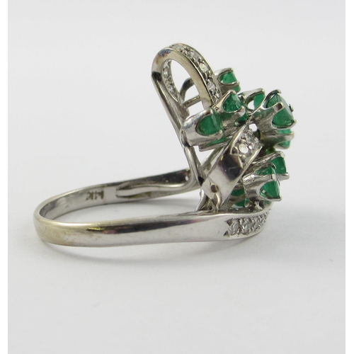 798 - An emerald and diamond cluster ring