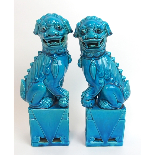 80 - A pair of Chinese blue glazed models of Kylin