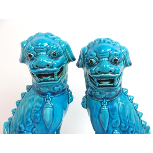 80 - A pair of Chinese blue glazed models of Kylin