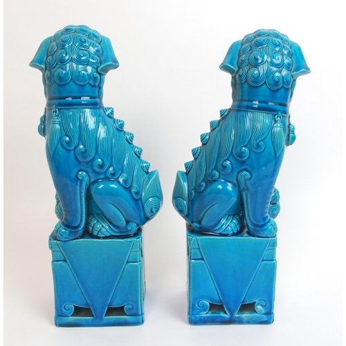 80 - A pair of Chinese blue glazed models of Kylin