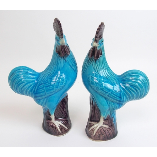 80 - A pair of Chinese blue glazed models of Kylin