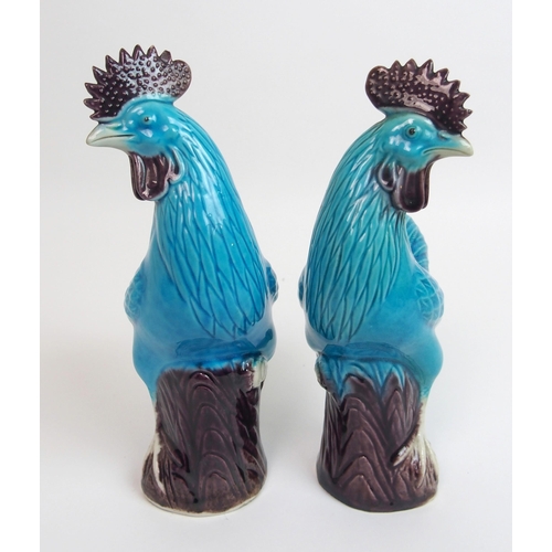 80 - A pair of Chinese blue glazed models of Kylin