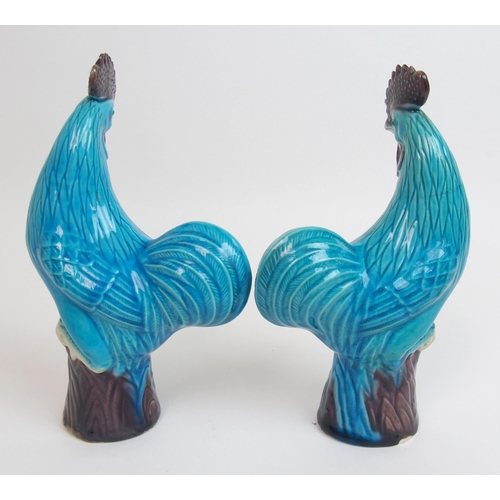 80 - A pair of Chinese blue glazed models of Kylin