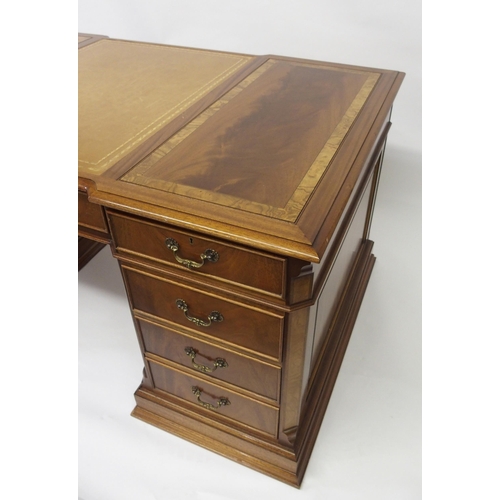 803 - A modern mahogany and crossbanded twin pedestal desk