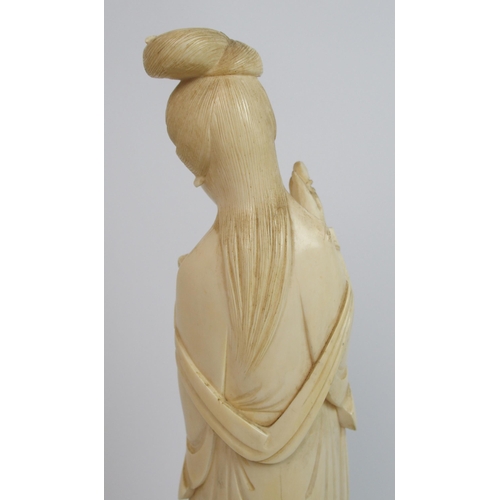 82 - A Chinese ivory figure of a lady