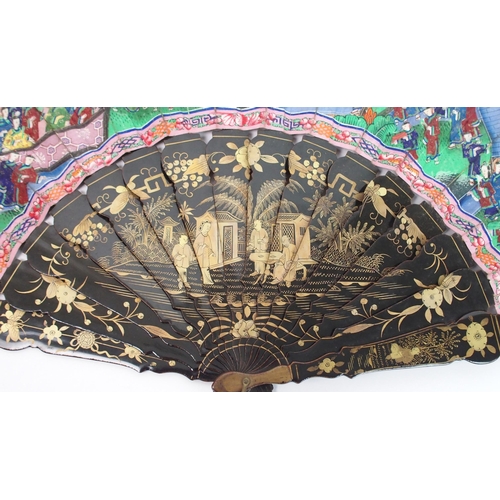 91 - A Chinese export black and gold double-sided lacquered fan