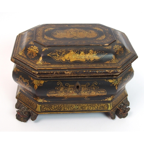 92 - A Chinese export black and gold lacquered octagonal shaped tea caddy