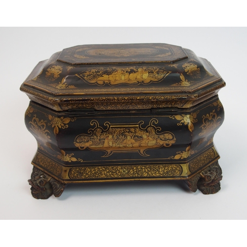 92 - A Chinese export black and gold lacquered octagonal shaped tea caddy