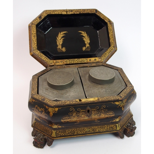 92 - A Chinese export black and gold lacquered octagonal shaped tea caddy