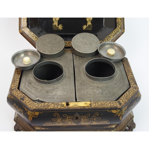 92 - A Chinese export black and gold lacquered octagonal shaped tea caddy