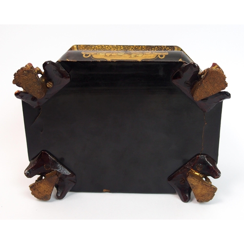 92 - A Chinese export black and gold lacquered octagonal shaped tea caddy