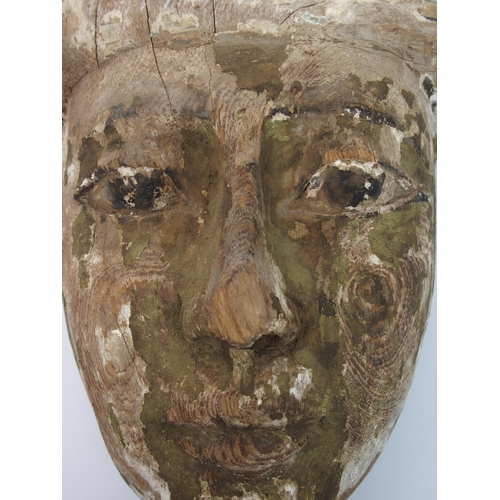 95 - An Egyptian painted wood sarcophagus mask