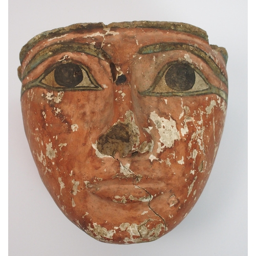 96 - An Egyptian painted wood sarcophagus mask