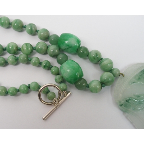 97 - A Chinese green hardstone pendant necklace