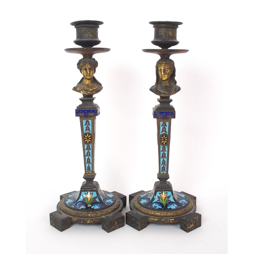 1062 - A pair of French champleve enamel and gilt bronze candlesticks