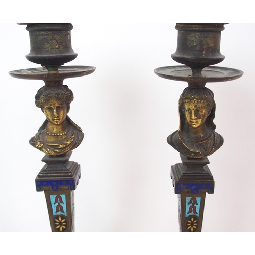 1062 - A pair of French champleve enamel and gilt bronze candlesticks