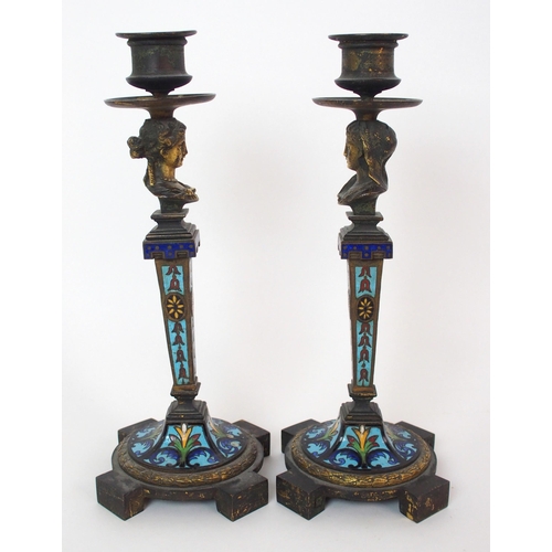 1062 - A pair of French champleve enamel and gilt bronze candlesticks