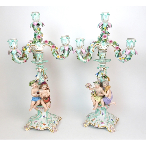 1063 - A pair of Meissen porcelain four-light candelabra