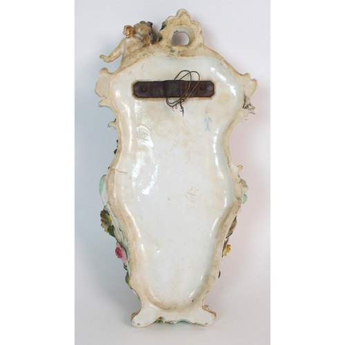 1064 - A pair of Continental porcelain figural groups and a Continental porcelain wall pocket