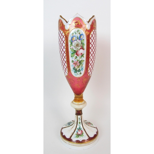 1065 - A pair of Royal Worcester porcelain ewers with a cranberry glass and enamelled footed vase