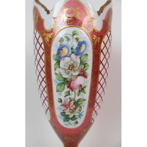 1065 - A pair of Royal Worcester porcelain ewers with a cranberry glass and enamelled footed vase