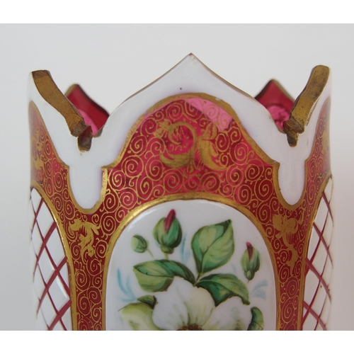 1065 - A pair of Royal Worcester porcelain ewers with a cranberry glass and enamelled footed vase