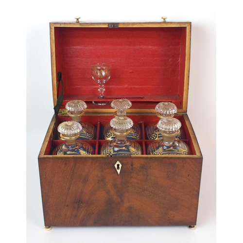 1075 - An English Regency decanter set in mahogany case