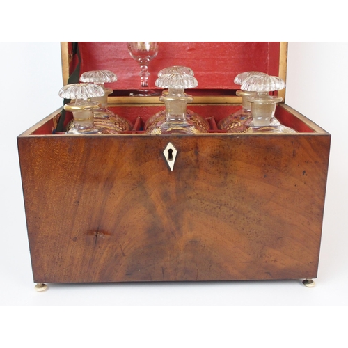 1075 - An English Regency decanter set in mahogany case