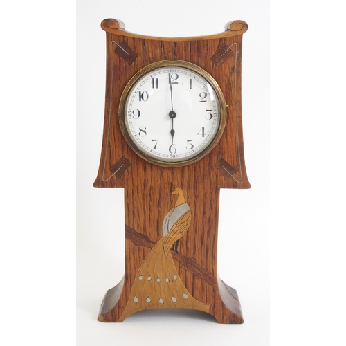 1076 - An Arts and Crafts oak mantle clock