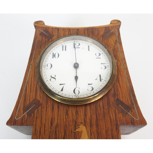 1076 - An Arts and Crafts oak mantle clock