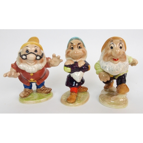 1090 - A Group of Beswick figures depicting Snow White and the Seven Dwarfs