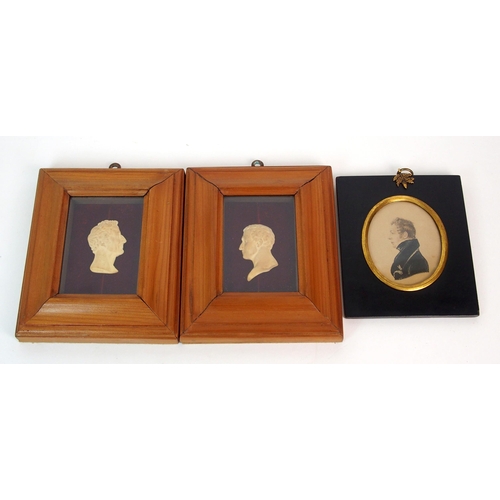 1094 - A pair of miniature portraits in profile and a miniature portrait of a gentleman