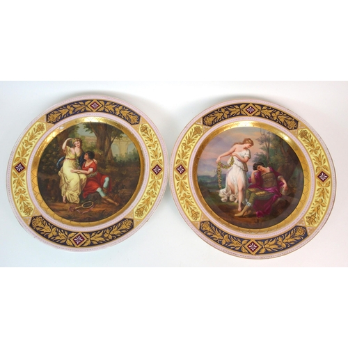 1096 - Two Viennese porcelain painted and parcel gilt plates