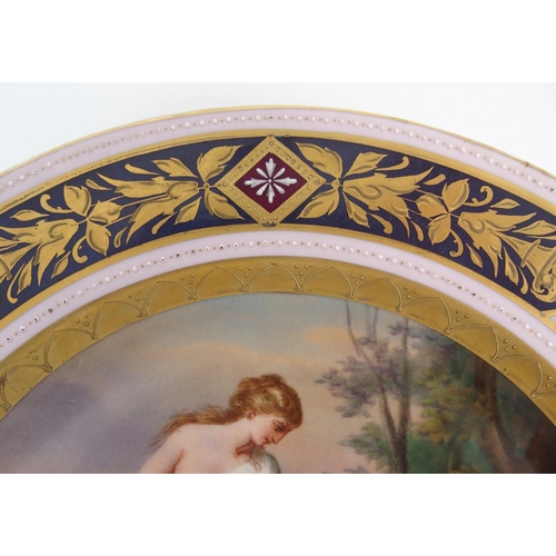 1096 - Two Viennese porcelain painted and parcel gilt plates