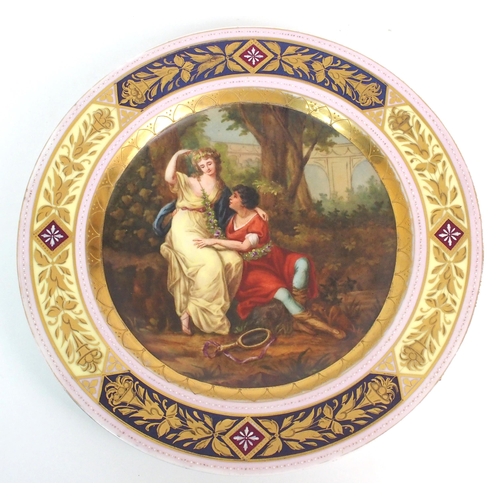 1096 - Two Viennese porcelain painted and parcel gilt plates