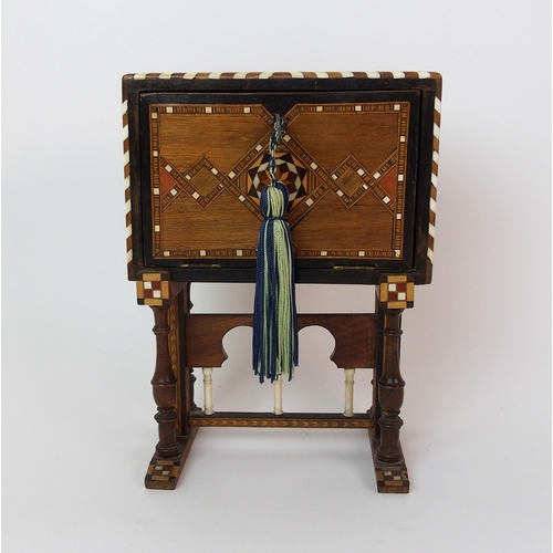 1122 - A Moroccan-style mahogany and fruitwood inlaid miniature cabinet