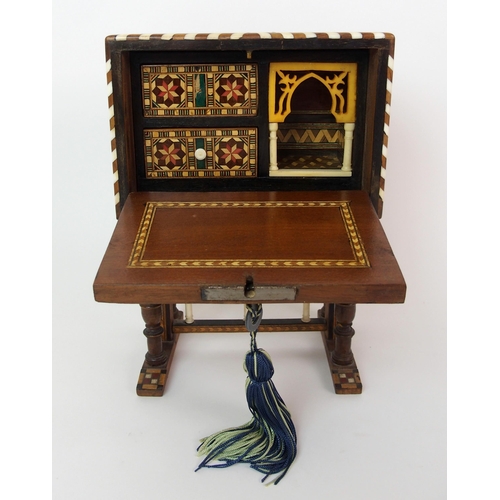 1122 - A Moroccan-style mahogany and fruitwood inlaid miniature cabinet