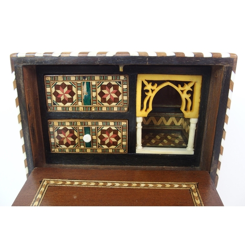 1122 - A Moroccan-style mahogany and fruitwood inlaid miniature cabinet