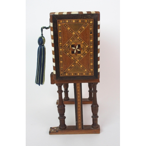 1122 - A Moroccan-style mahogany and fruitwood inlaid miniature cabinet