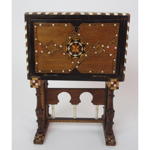 1122 - A Moroccan-style mahogany and fruitwood inlaid miniature cabinet