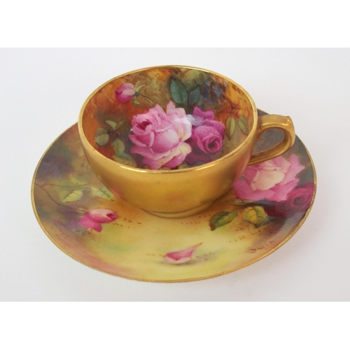 1124 - A Royal Worcester painted porcelain cabinet cup and saucer