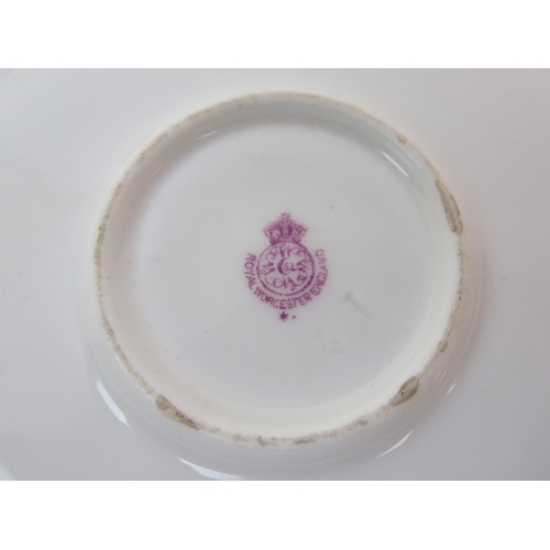 1124 - A Royal Worcester painted porcelain cabinet cup and saucer