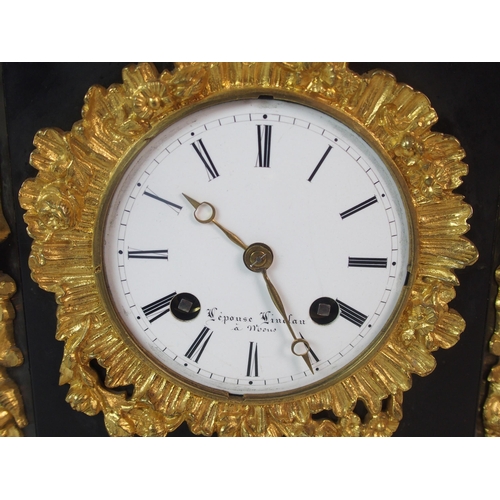 1143 - A French Empire-style black marble  gilt and patinated bronze mantle clock