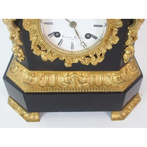 1143 - A French Empire-style black marble  gilt and patinated bronze mantle clock