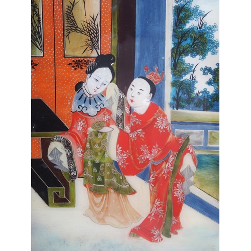 22 - A Chinese reverse painted glass picture of a couple