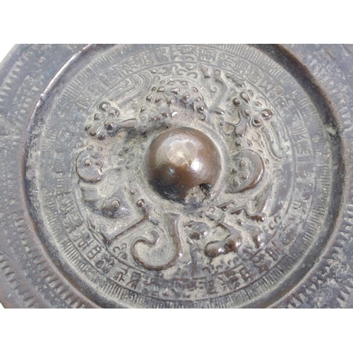 44 - A Chinese bronze circular hand mirror