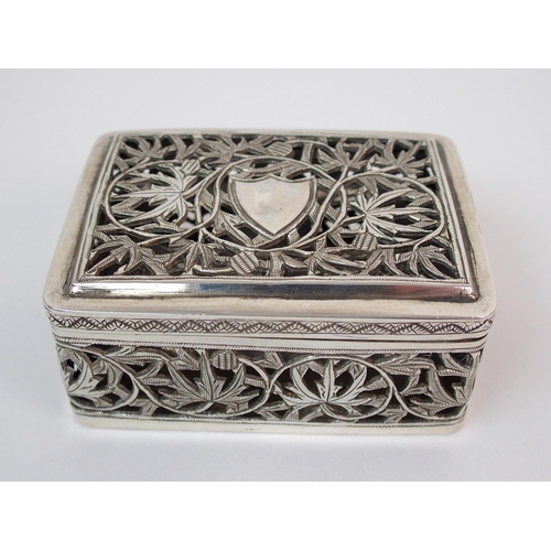 52 - An Asian white metal pierced box
