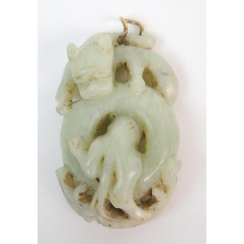 54 - A Chinese jade carving of an entwined dragon